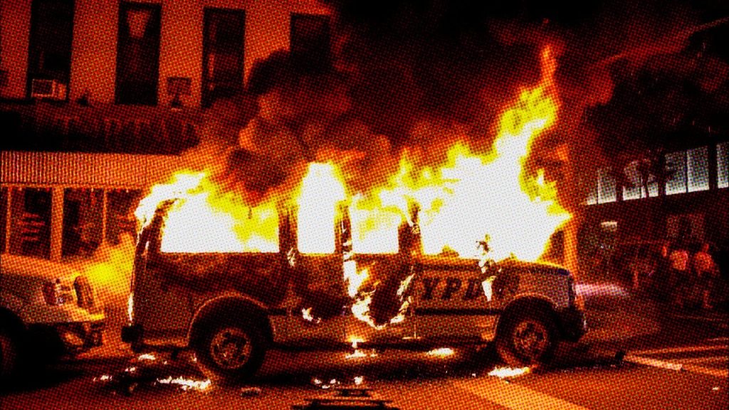 NYPD car burning during the George Floyd uprising.